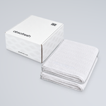 AeroWeave Bath Towel Gift Set with two Pure White towels stacked beside the Absofresh gift box