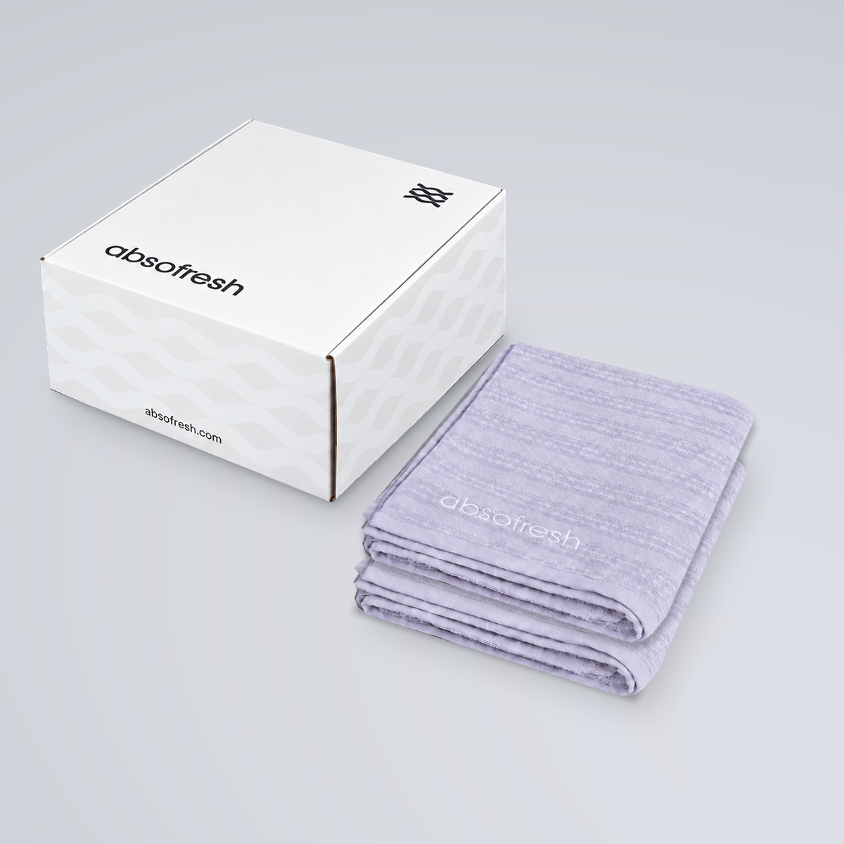 AeroWeave Kids Towel Gift Set with two Lilac Purple kids towels stacked beside the Absofresh gift box