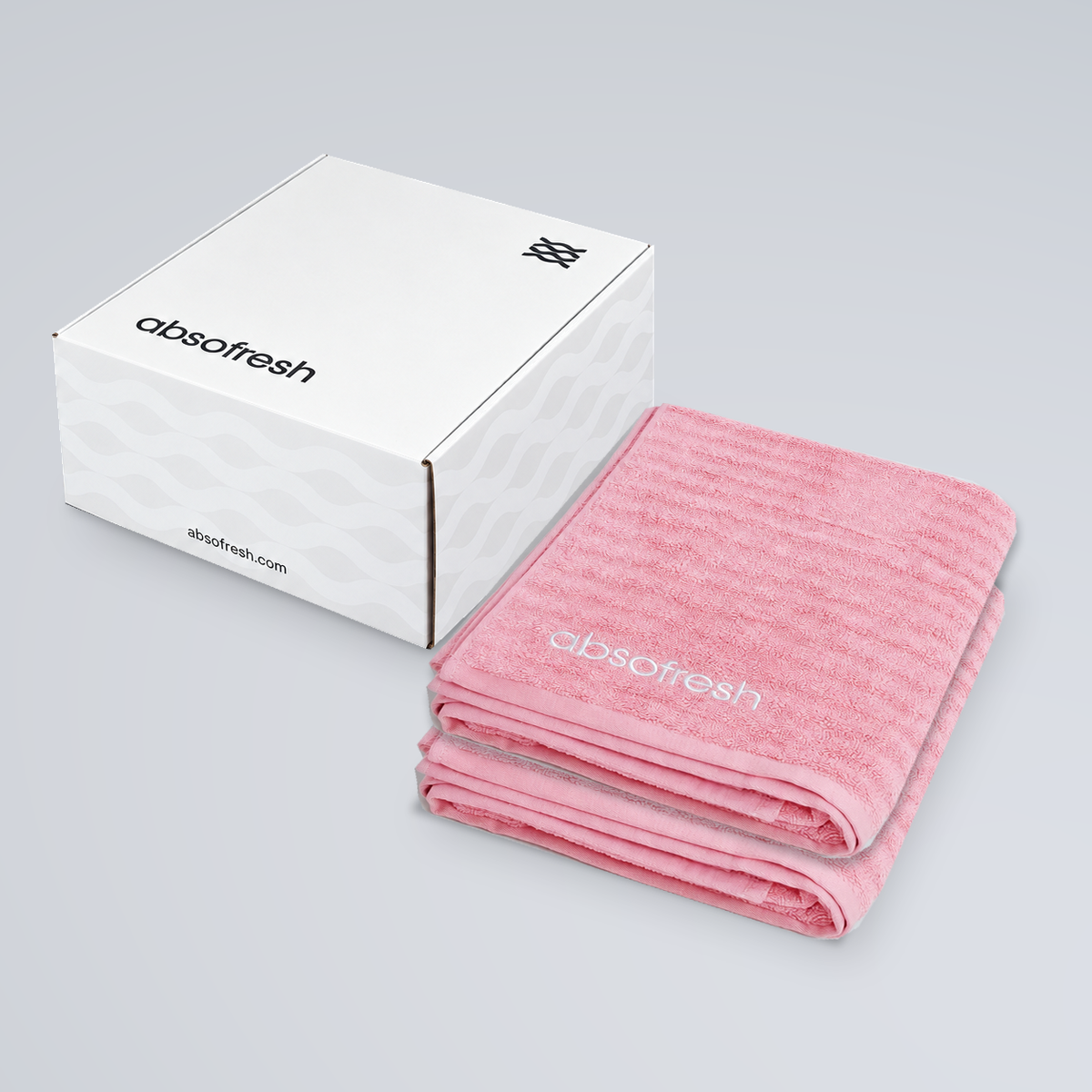 CloudWeave Bath Towel Gift Set with two Sakura Pink towels stacked beside the Absofresh gift box