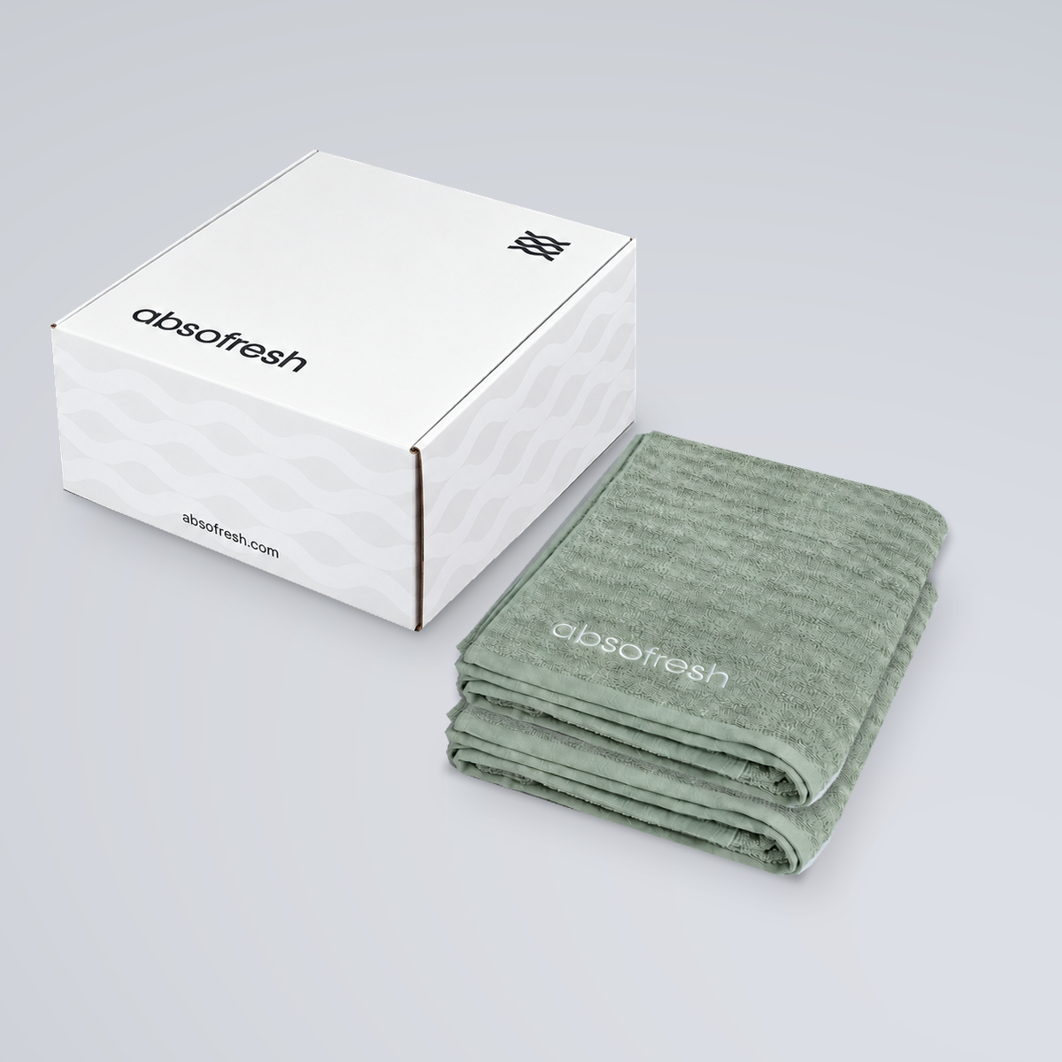 CloudWeave Kids Towel Gift Set with two Sage Green kids towels stacked beside the Absofresh gift box